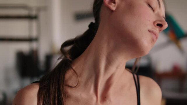 Woman Stretching Neck at Home