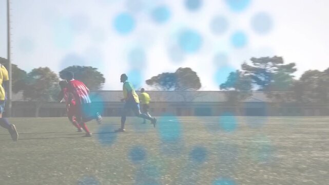 Male players moving after ball appearing, contesting possession and advancing, sports blue overlay