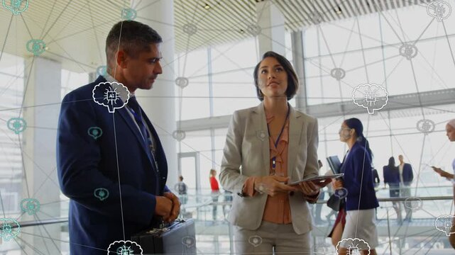 Woman lead pointing to feature above, red coat obscuring, pointing again, IT overlay linking icons