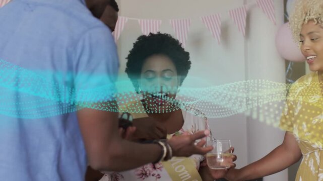 Mom-to-be wearing sash being fed cupcake after guest offering at shower, waveform moving over faces