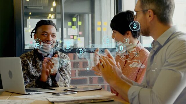 Hologram map appearing over table, team clapping laptop visible, B icons growing celebrating win
