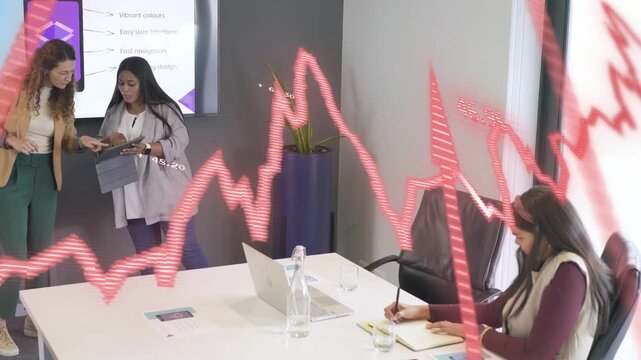 Lead presenter tapping tablet explaining phone mockup for design review red waveform crossing front