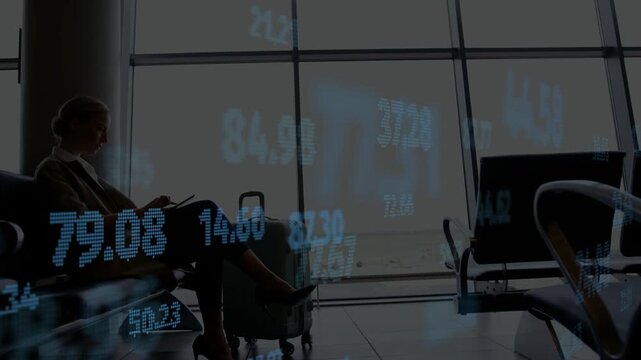 Woman tapping tablet at gate and generating finance numbers drifting across front tracking stocks