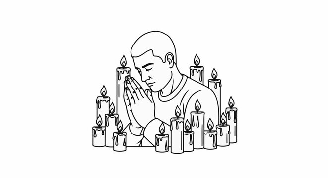 A man prays with his hands clasped surrounded by many lit candles