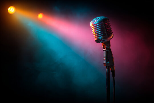 Vintage microphone illuminated by colorful stage lights in a dark setting, creating a vibrant atmosphere ideal for karaoke night or musical performances