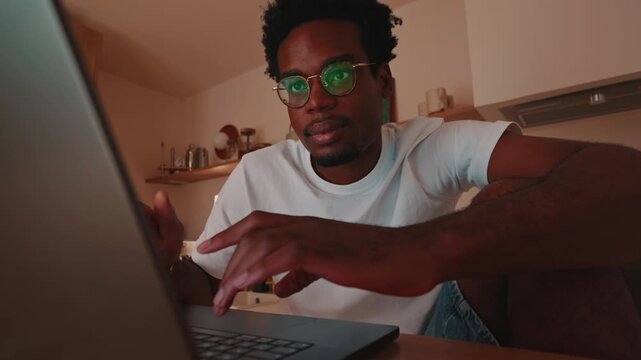 Young African American Man Working on Laptop