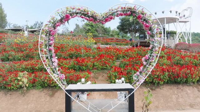 Pull Back Shot of Another Floral Heart Structure &ndash; Rao Dok Lom Lhao Community Garden