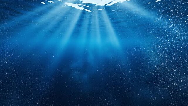 unbeams Shining Through Deep Blue Water Surface with Bubbles