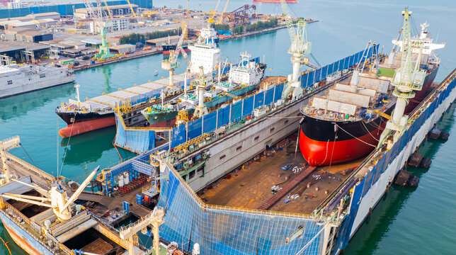 A full service shipyard and modern shipbuilding facility Dry dock with Cargo Ship maintenance or repair at floating dock