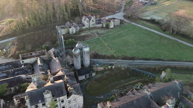 Aerial view of abandoned Denbigh Asylum, showing vast grounds, eerie decay