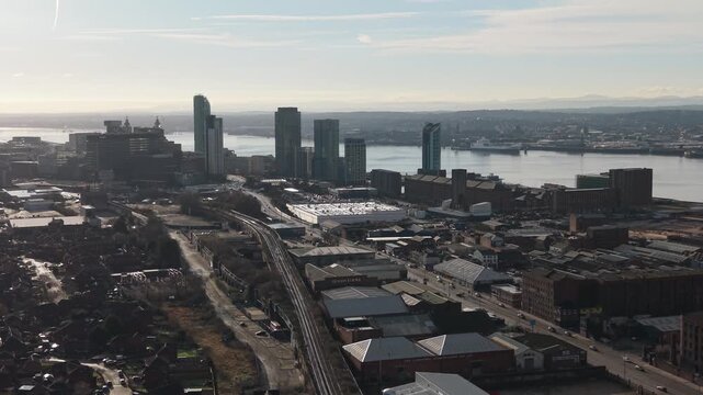 Aerial view of Everton Stadium area in UK, with cityscape and river