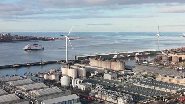 Wind Turbine At Huskisson Dock Along The River Mersey In Liverpool, England, UK. Aerial Shot