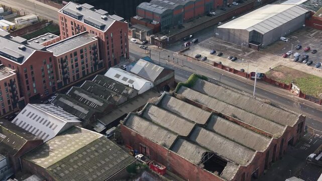 Aerial view of Everton Stadium and neighboring UK architecture, sunny day