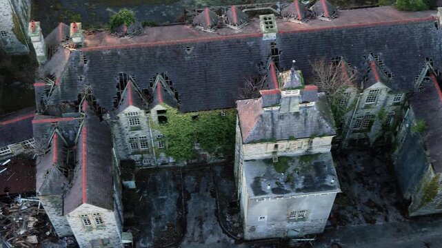 Dilapidated Buildings Of North Wales Hospital - Denbigh Asylum In Denbigh, Wales, United Kingdom. Aerial Shot