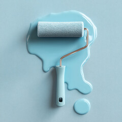 Obraz premium Paint roller with blue paint on textured surface home improvement dripping