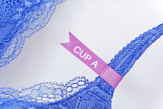 Lace bra with tag showing cup size A and vibrant blue color displayed on a white background