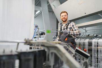Fototapeta premium Factory worker showing thumbs up during polypropylene production