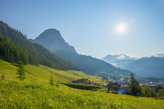 idyllic spring landscape with wildflowers, Sassongher mountain, Colfosco dolomites alps