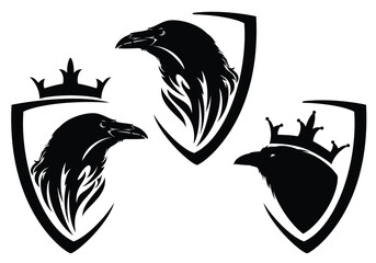 Obraz premium black raven bird profile head and heraldic shield decorated with royal crown black and white vector outline design set for fantasy king emblem