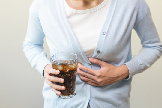 close-up women feeling pain in her chest from acid reflux