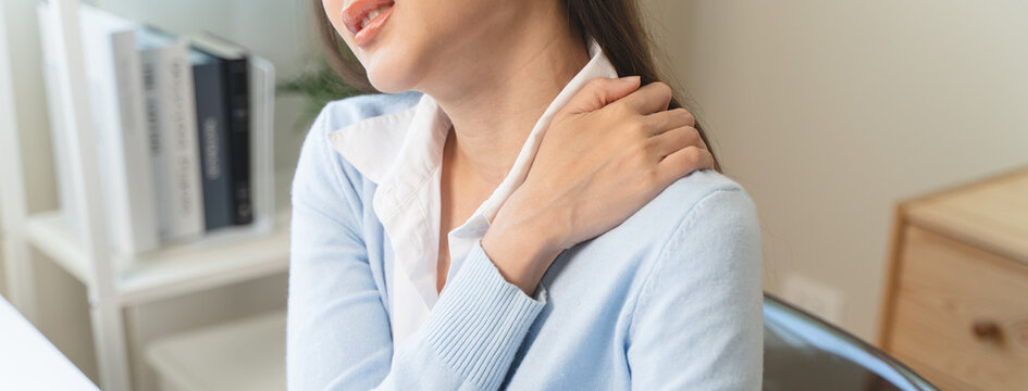 Office workers have neck pain from bad posture during sitting and work.