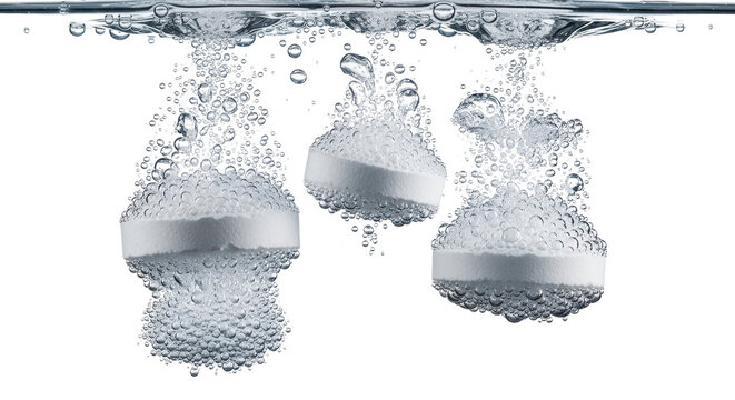 Effervescent soluble tablets falling in water with bubbles, white medical pills dissolving in liquid, healthcare and pharmacy concept isolated PNG with Transparent Background