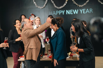 Fototapeta premium New year party celebration group of adult woman man office drink laugh happy festivity new year