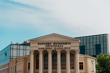 Fototapeta premium Facade of the National Theatre in Subotica, Serbia under a bright sky. Historic architecture and cultural heritage in the city center.