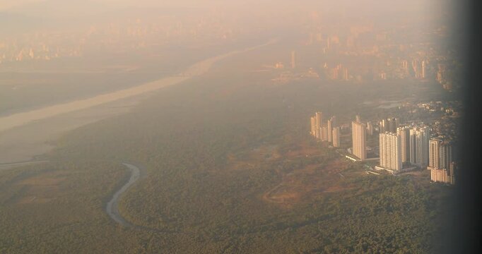 Ghansoli, Navi Mumbai, Maharashtra, India. Mumbai Metropolitan Region. Aerial View From Airplane Window On View of the Mumbai suburb district. Evening morning sunset sunrise light. residential