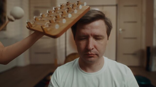 Sound healing session with wooden instrument and mallet