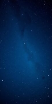 Dark blue sky filled with twinkling stars, majestic Milky Way stretching across the horizon, black, cosmic