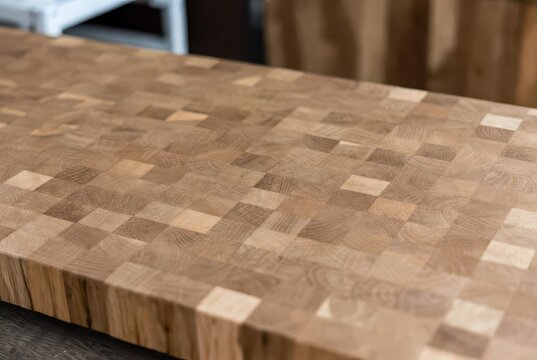 Detailed close-up of a natural oak end grain butcher block countertop surface