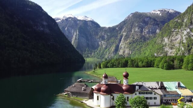 Aerial View of Historical Church with Red Domes on Apine Lake Shoreline