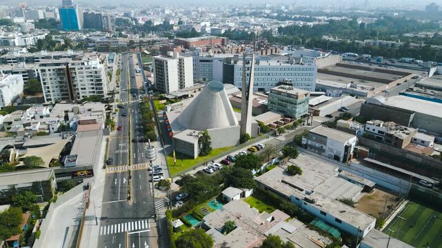 Majestic drone view of the Sagrado Coraz&oacute;n de Jes&uacute;s sanctuary in Surco, catholic church architecture in South America at sunset.