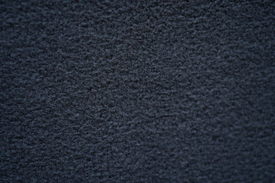 grey fleece fabric texture, macro texture fleece gray fabric photo above as background	
