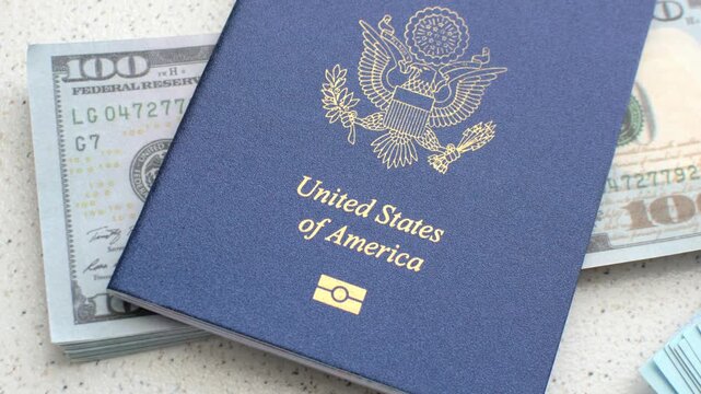 American Passport and Dollars: Fascinating detail of the US passport with dollar bills, symbolizing travel, exchange and money.