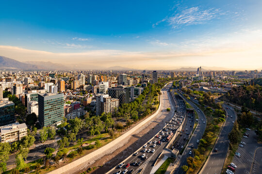 Santiago de Chile sunset panorama. This aerial shot captures Providencia district, the downtown, Mapocho River and the parallel Costanera Norte highway.
