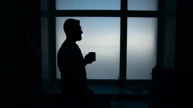 Silhouette Of Individual Contemplating Morning. Quiet Morning Scene With Coffee And Hopeful Outlook . Media