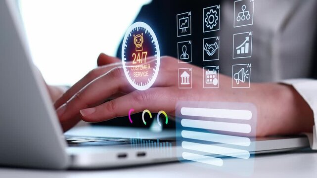 Hand using laptop with customer service icons and data analysis symbols displayed on the screen.