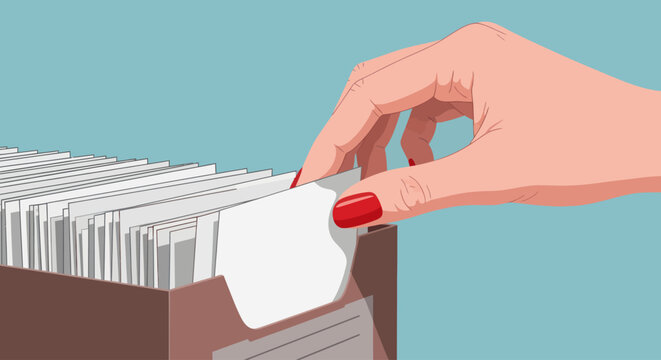 Hand searching through card index file box for organization and record keeping