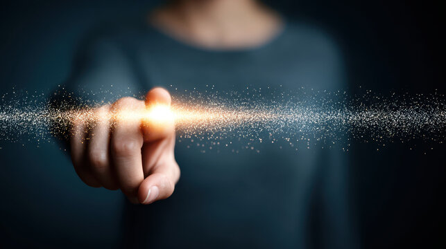 Large glowing light appears at fingertip of person symbolizing artificial intelligence and large language models LLM in dark background