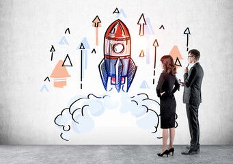 Two business people look at hand‑drawn rocket launch in creative style on light background,...