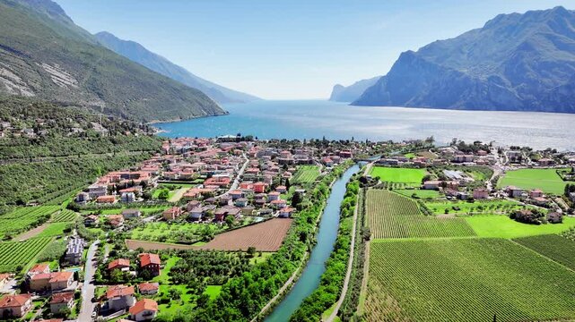 Lake Garda with mountain landscape and wide water surface. Alpine scenery and coastline in northern Italy natural travel destination