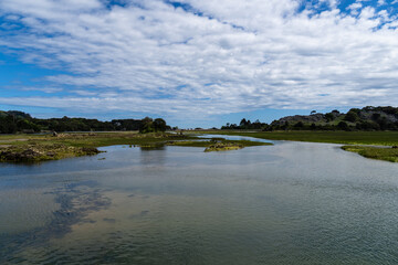 Fototapeta premium Scenic view of the wetlands of Joyel in Cantabria, Spain, on a sunny day