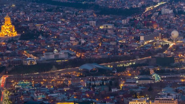 Tbilisi, Georgia. Aerial view of the city center of Tbilisi, Georgia. Time-lapse with car traffic from evening to night, panning video