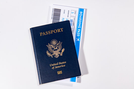 US passport with boarding pass for travel. Travel documents for international trip. Airport check in concept. American passport and airline tickets. Vacation and travel theme.