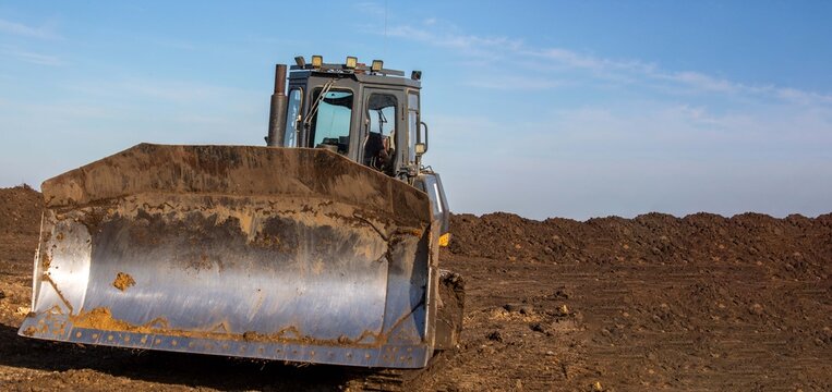 A bulldozer is working on road construction.