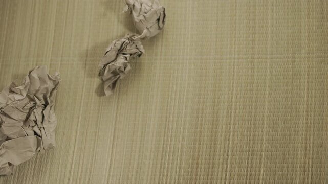 Throwing brown creased paper