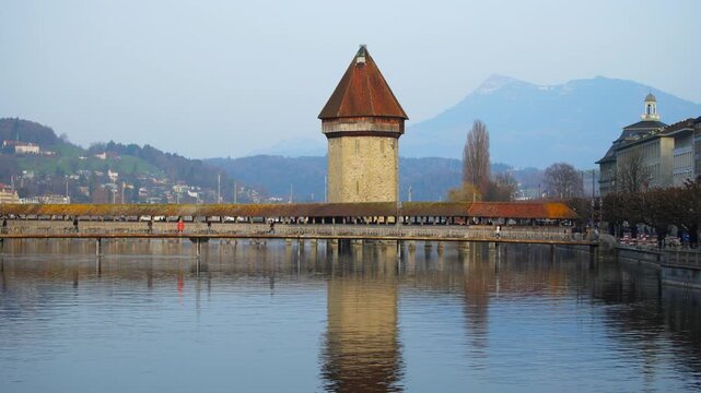 Historic Chapel Bridge and Water Tower on the Reuss River in Lucerne