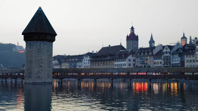 Shot of historic Chapel Bridge and Wasserturm tower in Lucerne, Switzerland